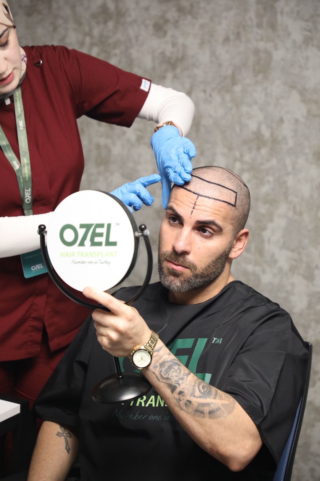 A client checking his new hairline design in a mirror